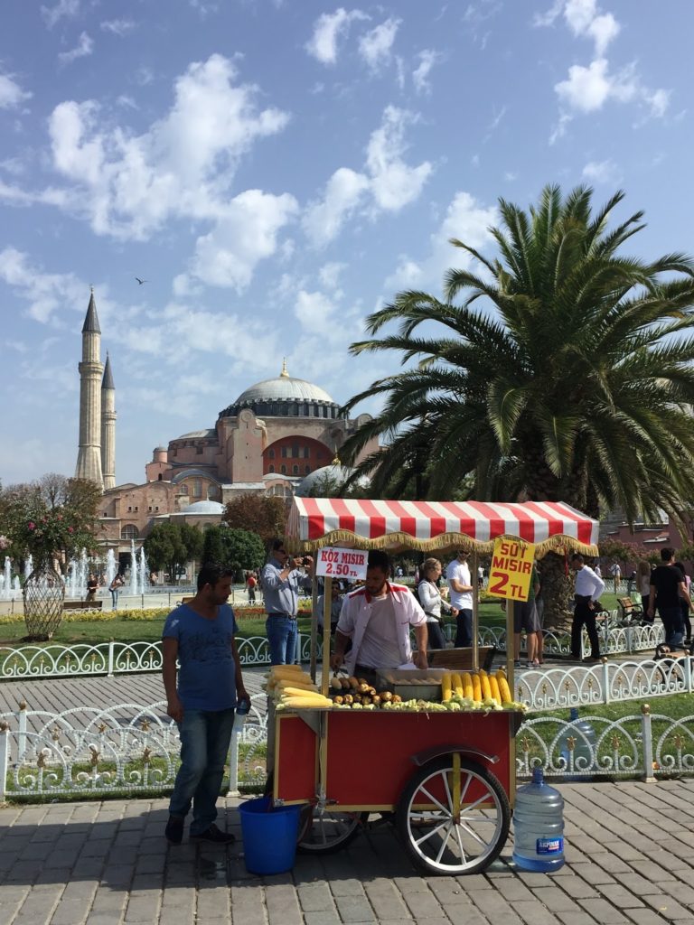 Man selling corncobs