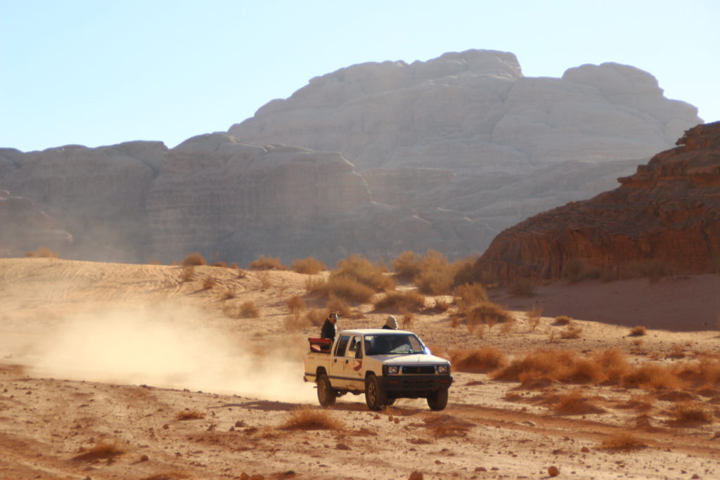 A jeep driving in the desert