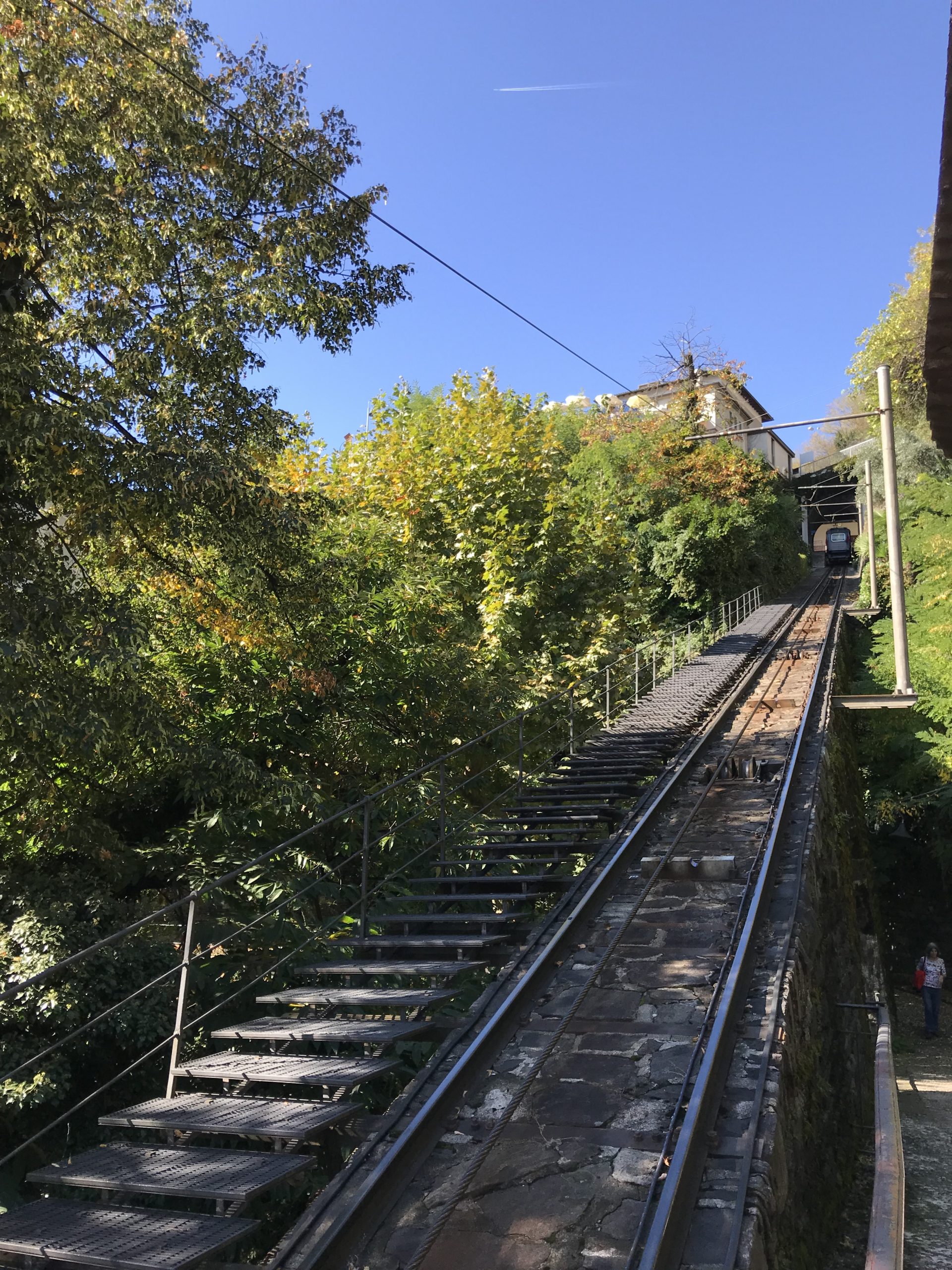 Taking the cable car to go up Mount Madonna del Sasso