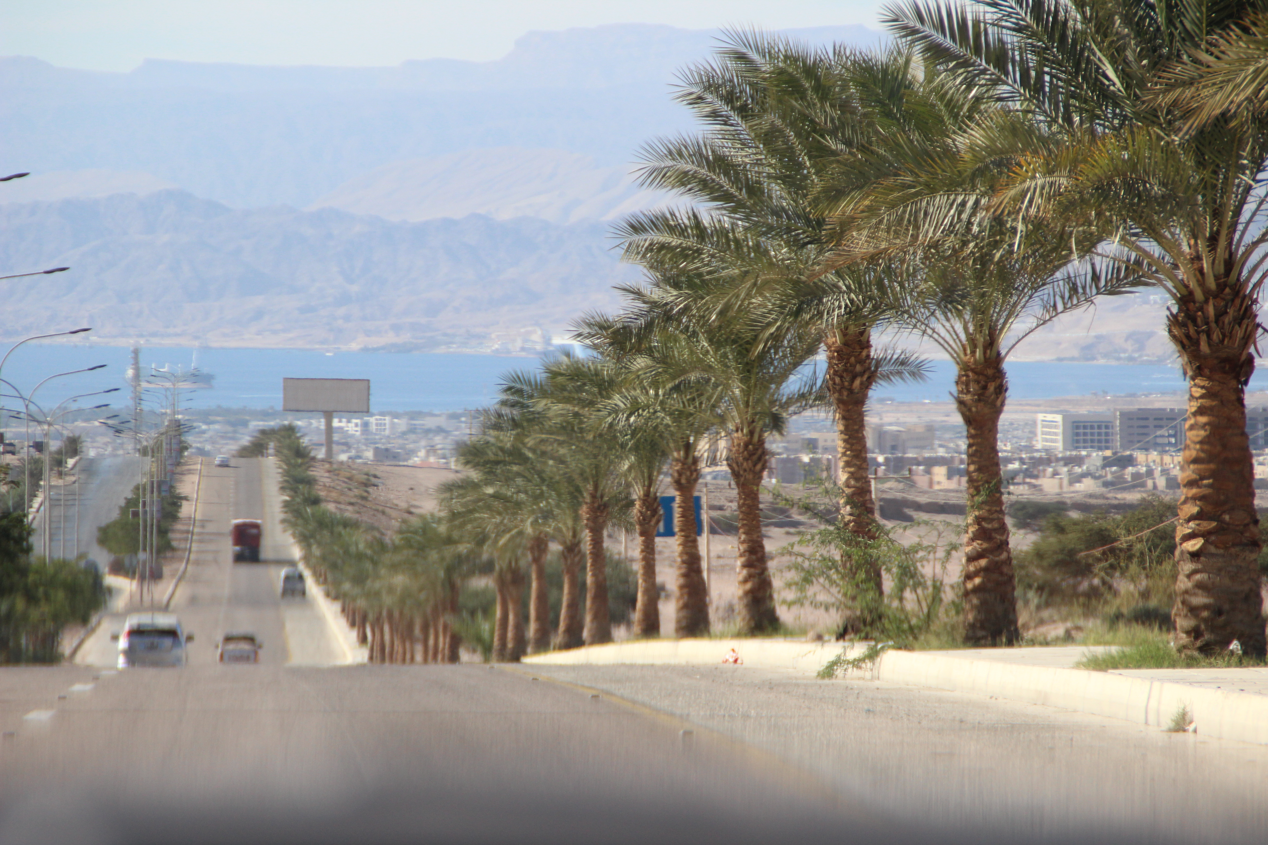 Arriving to Aqaba with the Red Sea at the end of the road
