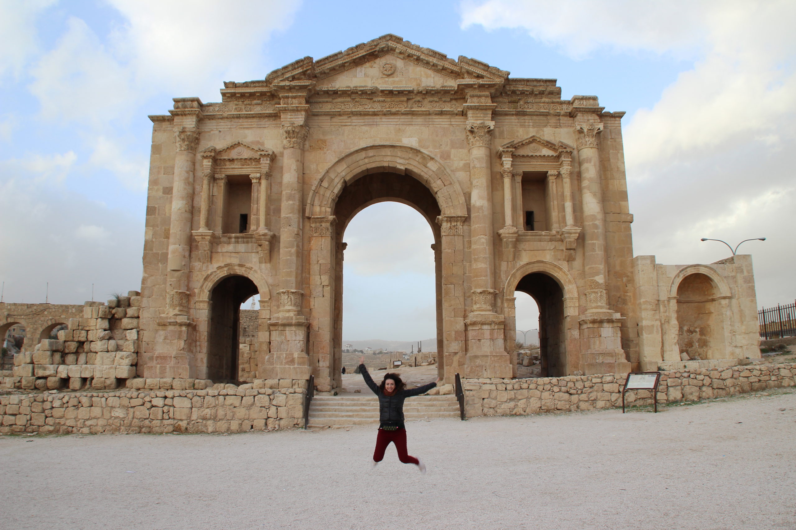 Jumping in front of the Arch of Adrian