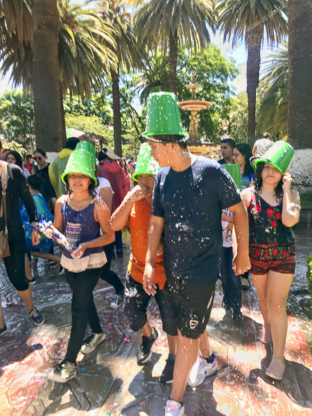 Tarija locals with buckets on their heads