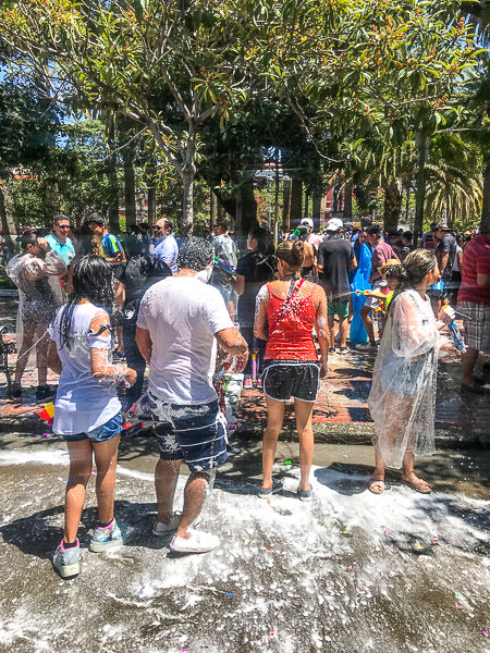 Wet people in Plaza Luis de Fuentes