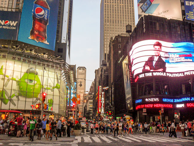 Times Square is a bustling spot filled with people and neon lights