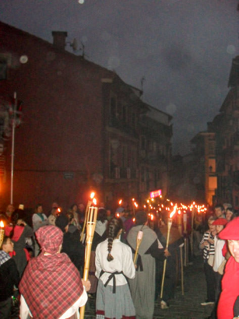 Antorcheras, women walking at night carrying lit torches
