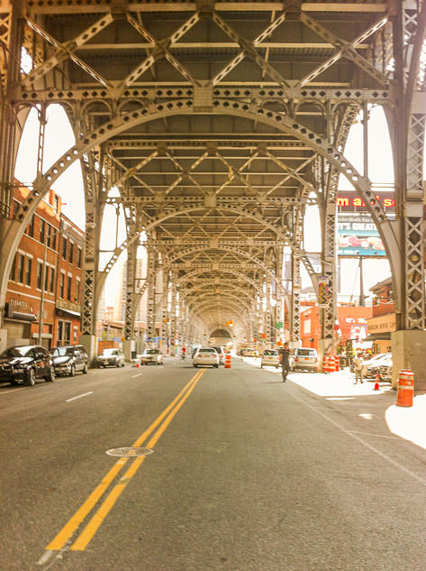 Walking under a huge bridge in Harlem