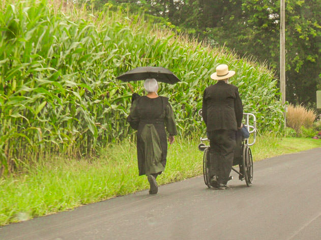 An Amish couple on foot