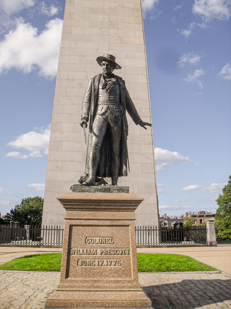 A statue in front of the Bunker Hill Monument