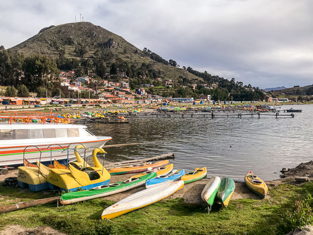 Canoes and pedal boats on the shores of lake Titicaca