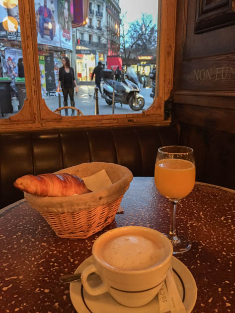 Enjoying breakfast with a Parisian view in Café Le Petit Poucet