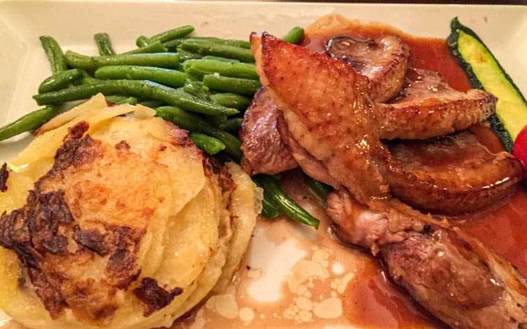 Duck with a side of potatoes and veggies at Zinc d'Honoré