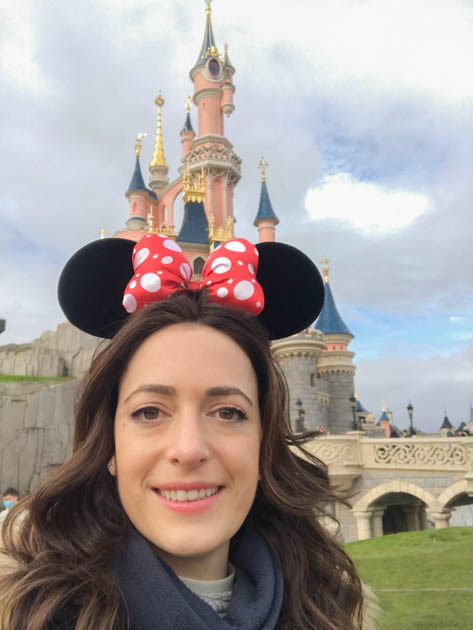 Happy kid in front of the Sleeping Beauty Castle