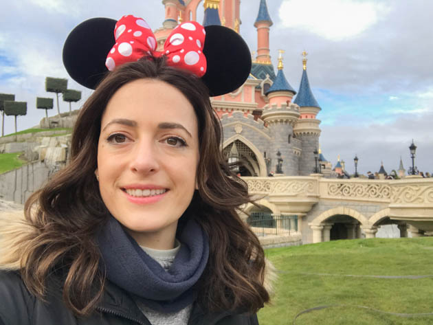 Posing with my Minnie headband in front of the Sleeping Beauty castle