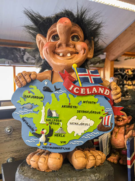 Cute troll holding a map of Iceland