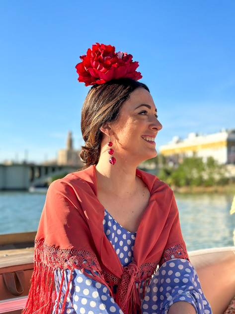 Cruising the Guadalquivir river dressed as a flamenca