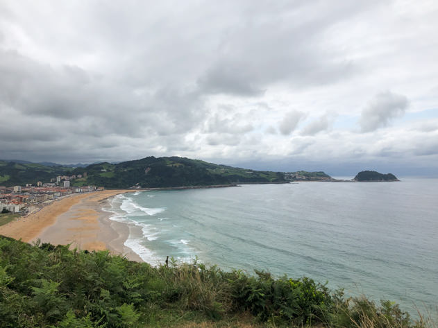 Arriving to the beach in Zarauz, with Getaria in the background