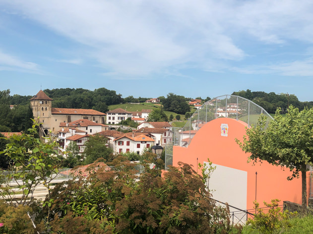 View of Espelette with the fronton and the church in the background