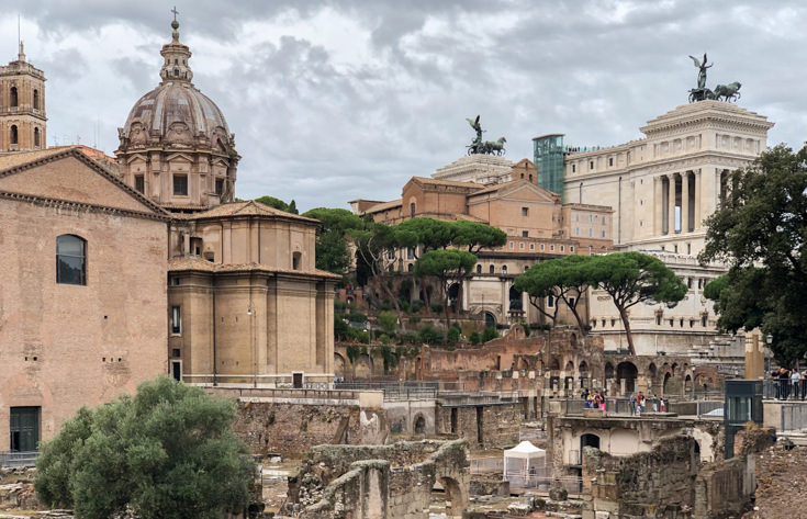 Ruins and monuments scattered along Via dei Fori Imperiali