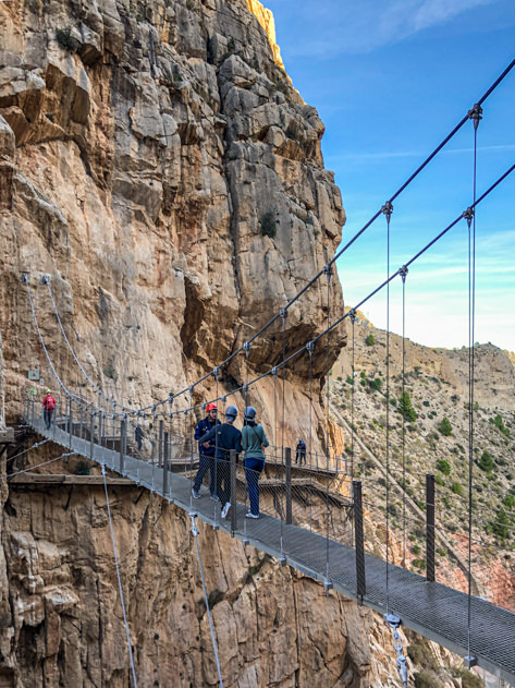 Visitors crossing the Caminito suspension bridge