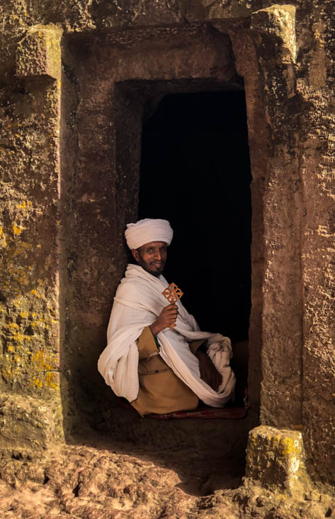 Priest holding an Ethiopian Orthodox cross