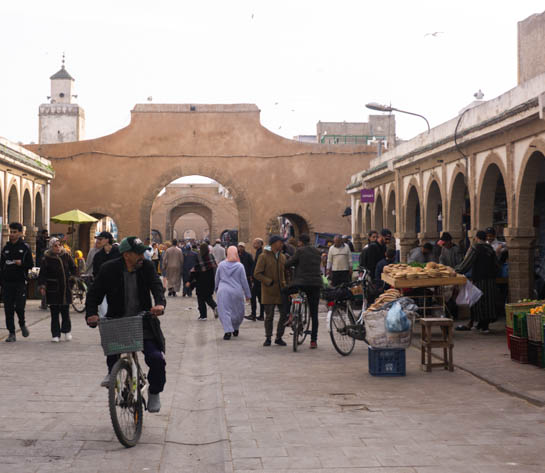 A man drives a bike in the souk of Essaouira