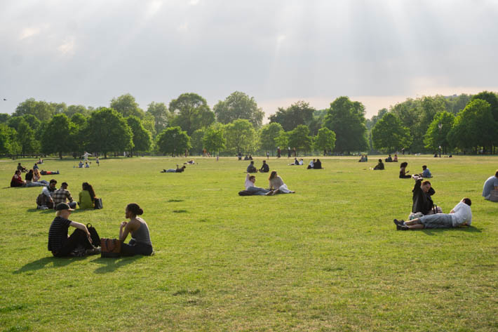Londoners enjoying a warm spring afternoon in Hyde Park