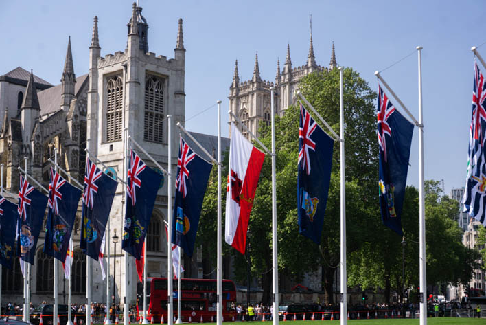 Westminster Abbey surrounded by flags
