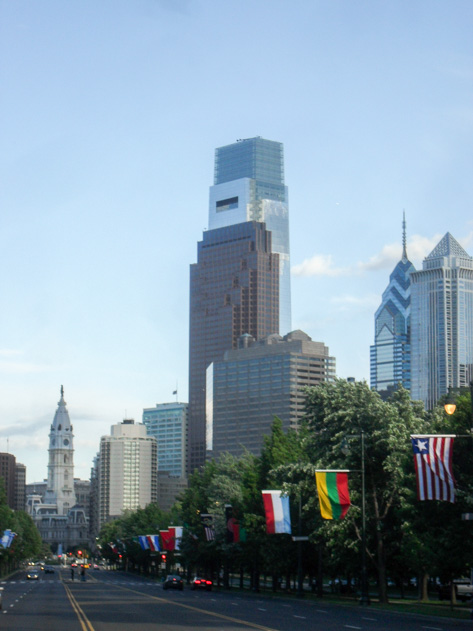 Benjamin Franklin Parkway lined with international flags leading toward Philadelphia City Hall