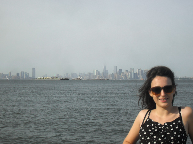 Me standing near waterfront with New York City skyline in the background