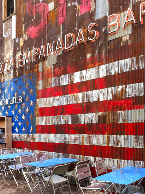 Restaurant wall with American flag street art in New York City